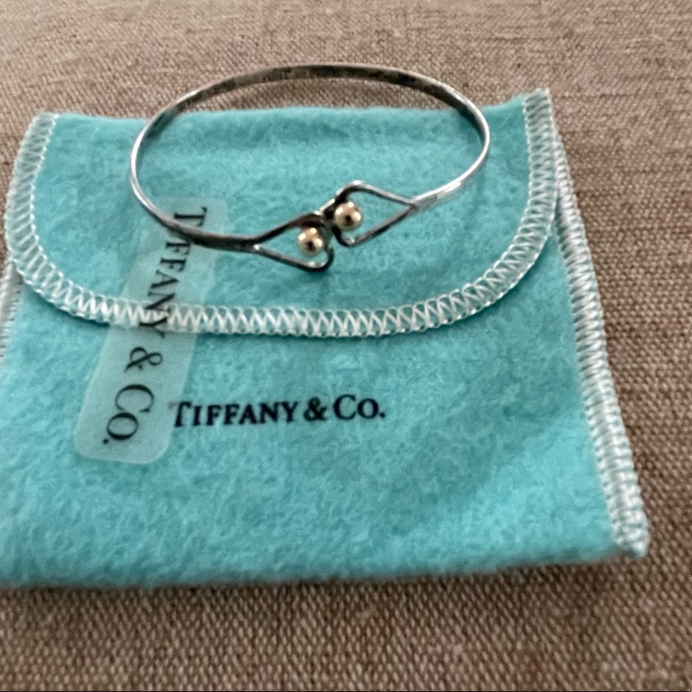 Tiffany and Co. interlocking heart sterling silver bracelet with 18k gold trim